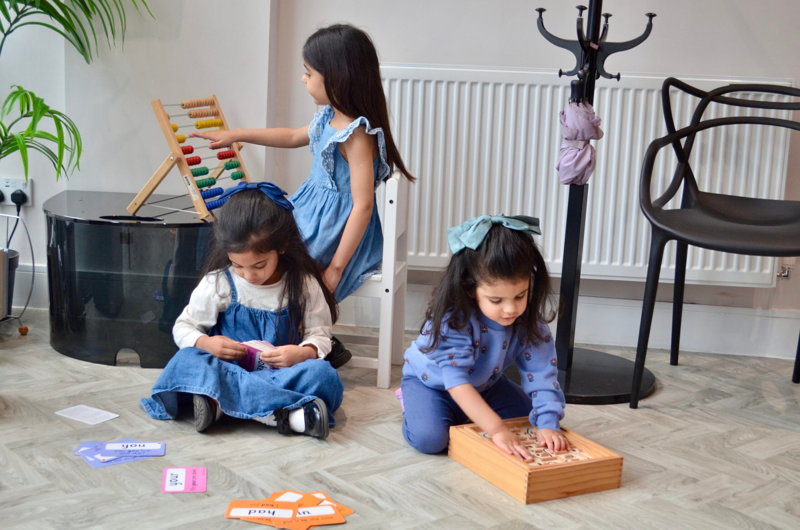 Paediatrician examining child patient with parent present
