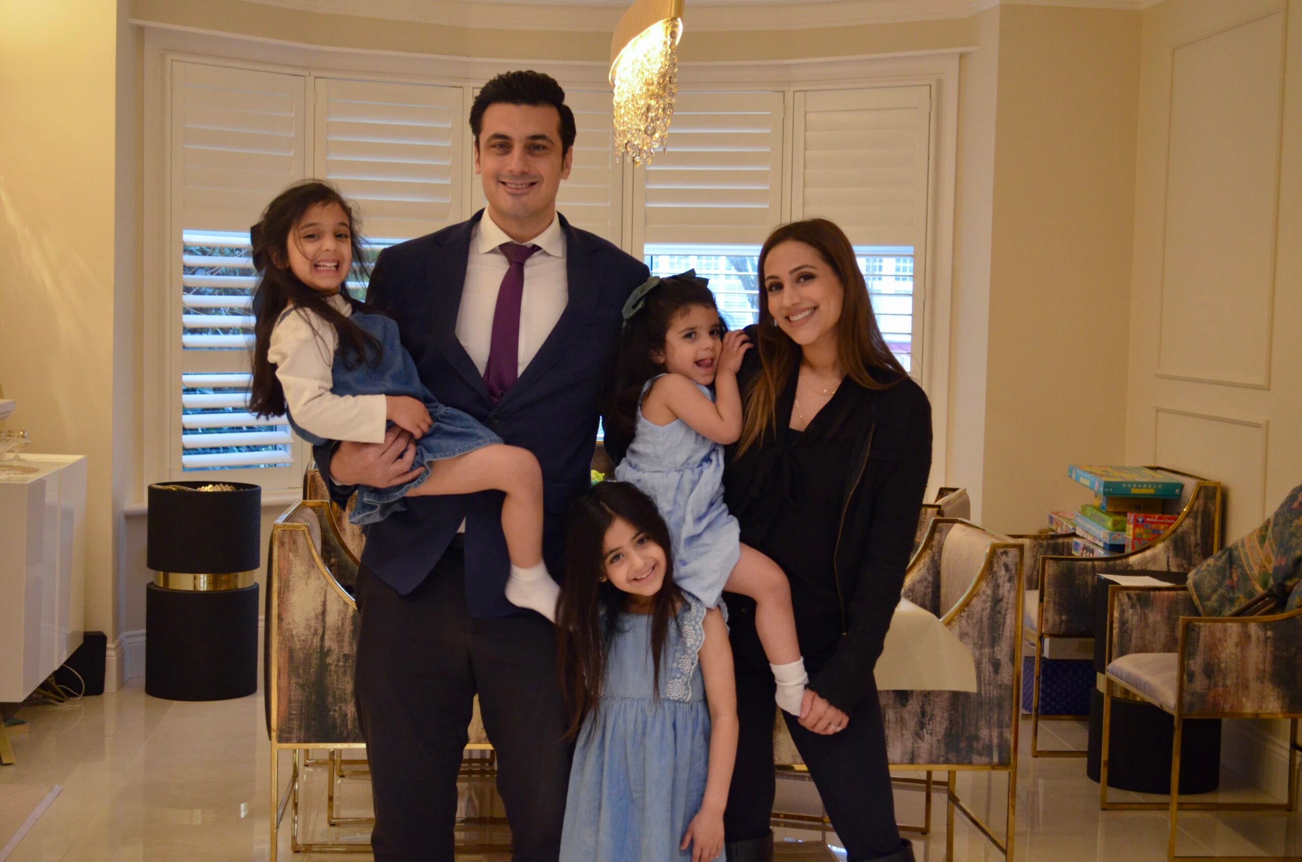 360 Med doctor with family in clinic reception area